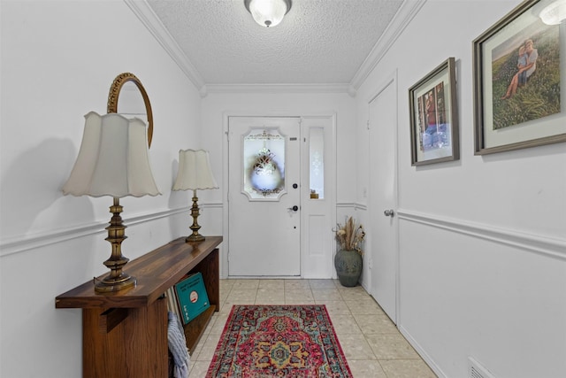 6737 Oliver Dr, North Richland Hills, TX 76180 - foyer entrance with a textured ceiling, ornamental molding, and light tile patterned floors