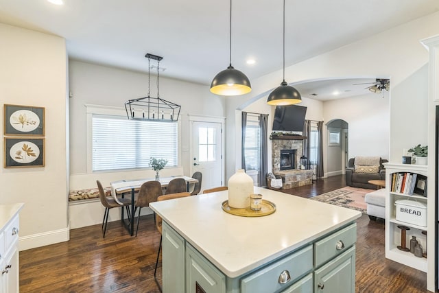 210 Walker Ct N, Waxahachie, TX 75167 - kitchen with green cabinets, dark wood-type flooring, light countertops, ceiling fan, and recessed lighting