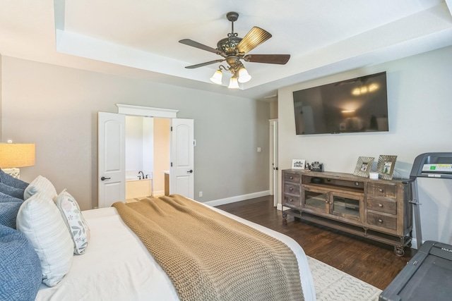 210 Walker Ct N, Waxahachie, TX 75167 - bedroom with wood finished floors, ensuite bathroom, ceiling fan, and a raised ceiling