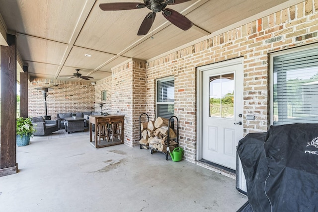 210 Walker Ct N, Waxahachie, TX 75167 - view of exterior entry with ceiling fan, an outdoor hangout area, a patio area, and brick siding
