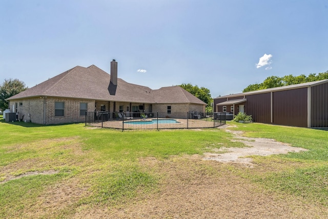 210 Walker Ct N, Waxahachie, TX 75167 - rear view of property featuring a chimney and brick siding