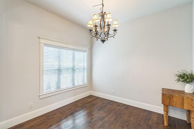 210 Walker Ct N, Waxahachie, TX 75167 - unfurnished room with a chandelier and dark wood finished floors