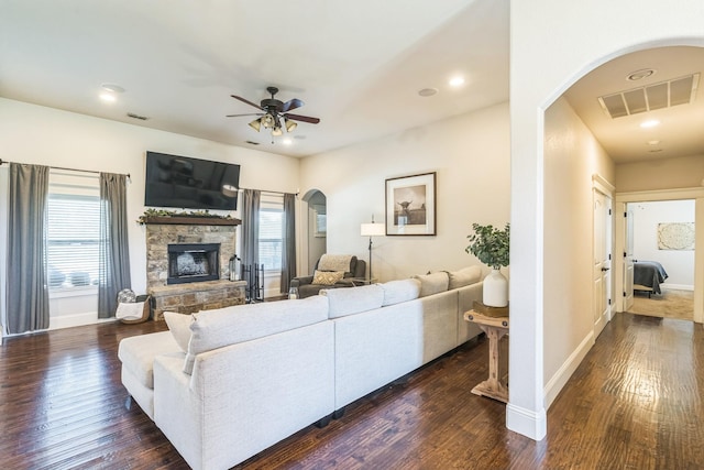 210 Walker Ct N, Waxahachie, TX 75167 - living room with arched walkways, dark wood-style floors, plenty of natural light, and recessed lighting