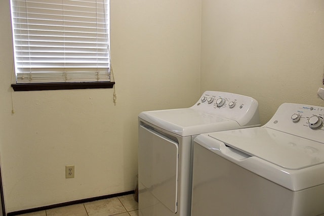 1125 Siebold Ct, Mesquite, TX 75150 - laundry area with washing machine and dryer and light tile patterned floors