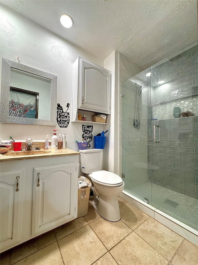 1125 Siebold Ct, Mesquite, TX 75150 - full bath featuring vanity, tile patterned floors, a shower stall, and a textured ceiling