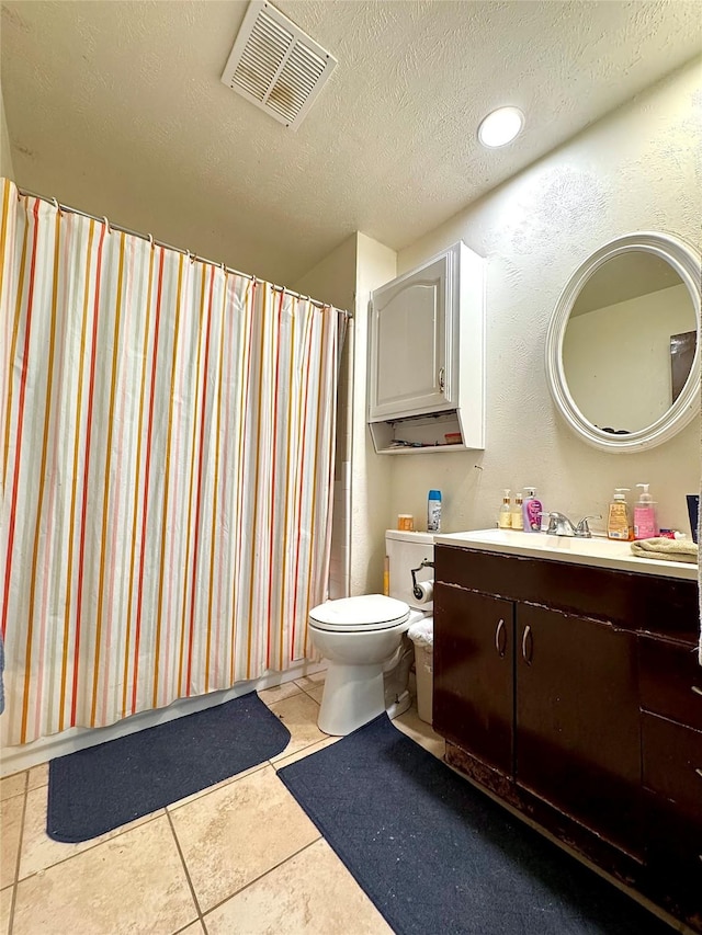 1125 Siebold Ct, Mesquite, TX 75150 - full bathroom featuring vanity, a textured ceiling, tile patterned floors, recessed lighting, and a shower with curtain