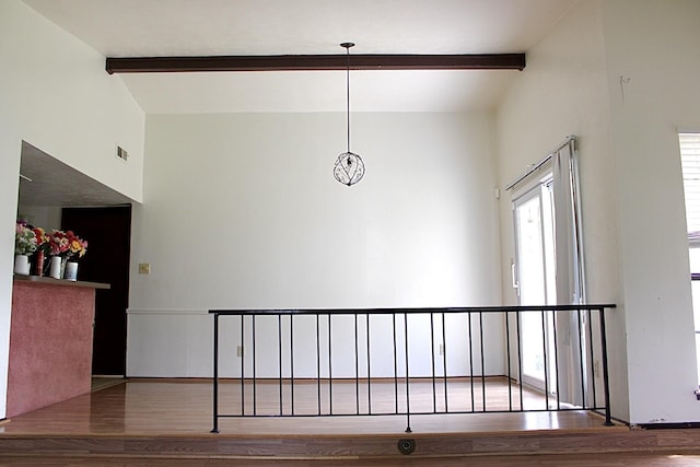 1125 Siebold Ct, Mesquite, TX 75150 - stairs featuring beam ceiling, wood finished floors, and a towering ceiling