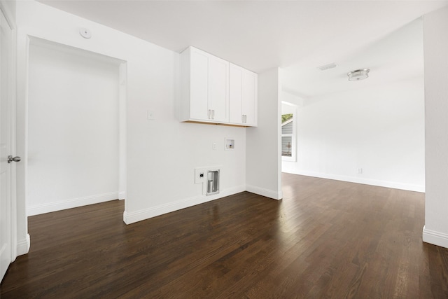 2267 Tealford Dr, Dallas, TX 75228 - laundry room with hookup for an electric dryer, dark wood finished floors, hookup for a washing machine, and cabinet space