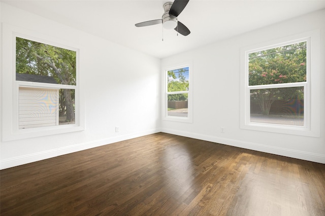 2267 Tealford Dr, Dallas, TX 75228 - empty room featuring plenty of natural light, dark wood-style flooring, and a ceiling fan