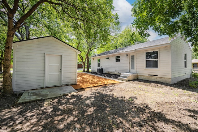 2267 Tealford Dr, Dallas, TX 75228 - rear view of property featuring a storage shed