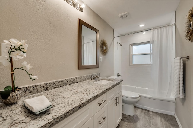 4053 Winfield Ave, Fort Worth, TX 76109 - bathroom featuring double vanity, wood finished floors, and shower / bath combo with shower curtain