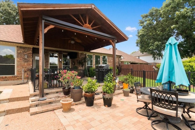 6321 Cobblestone Ln, Arlington, TX 76001 - view of patio with outdoor dining space, ceiling fan, and area for grilling