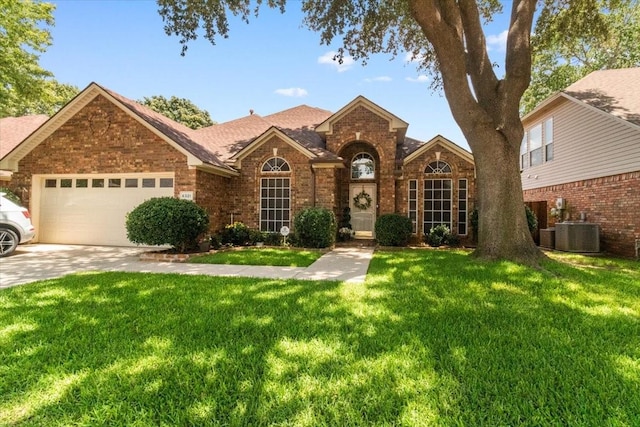 6321 Cobblestone Ln, Arlington, TX 76001 - traditional-style house with brick siding, a front lawn, an attached garage, concrete driveway, and a shingled roof
