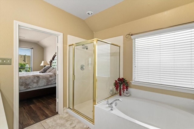 6321 Cobblestone Ln, Arlington, TX 76001 - ensuite bathroom with a garden tub, a stall shower, vaulted ceiling, and tile patterned floors