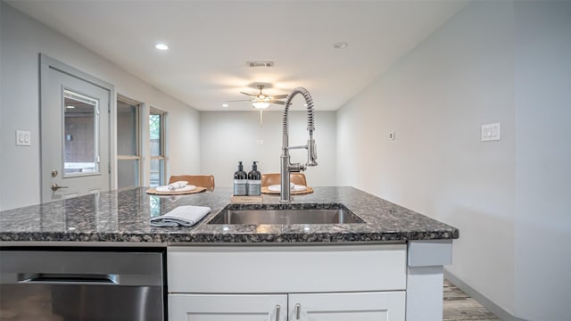 1031 Oak Hurst Dr, Grapevine, TX 76051 - kitchen featuring ceiling fan, stainless steel dishwasher, white cabinetry, light wood-type flooring, and recessed lighting