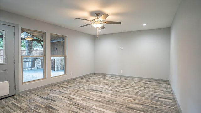 1031 Oak Hurst Dr, Grapevine, TX 76051 - empty room with a ceiling fan, wood finished floors, and recessed lighting