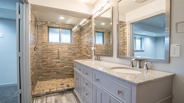 1031 Oak Hurst Dr, Grapevine, TX 76051 - bathroom with a shower stall, double vanity, and plenty of natural light