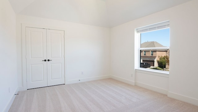 1032 Meadowlark, Forney, TX 75126 - unfurnished bedroom with carpet floors, a closet, and lofted ceiling
