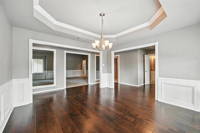 1208 Homestead St, Flower Mound, TX 75028 - empty room featuring a raised ceiling, a chandelier, ornamental molding, hardwood / wood-style flooring, and a decorative wall