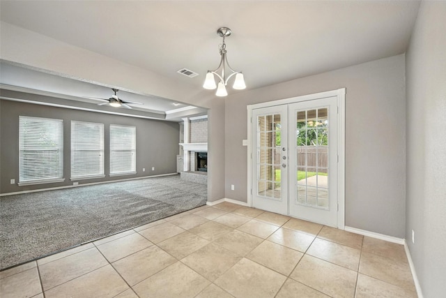 1208 Homestead St, Flower Mound, TX 75028 - unfurnished dining area featuring french doors, light tile patterned floors, a chandelier, and a ceiling fan