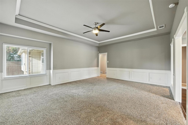1208 Homestead St, Flower Mound, TX 75028 - carpeted empty room with a tray ceiling, ceiling fan, ornamental molding, a decorative wall, and a smoke detector