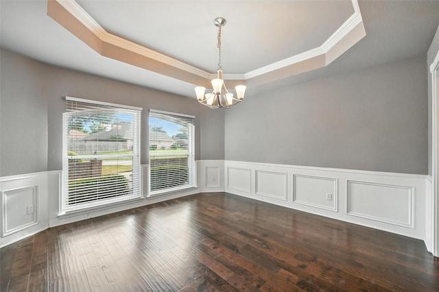 1208 Homestead St, Flower Mound, TX 75028 - spare room featuring a tray ceiling, a chandelier, ornamental molding, dark wood finished floors, and a wainscoted wall
