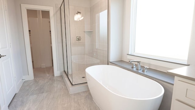 850 Blue Heron Dr, Forney, TX 75126 - bathroom with a freestanding bath, a shower stall, and vanity