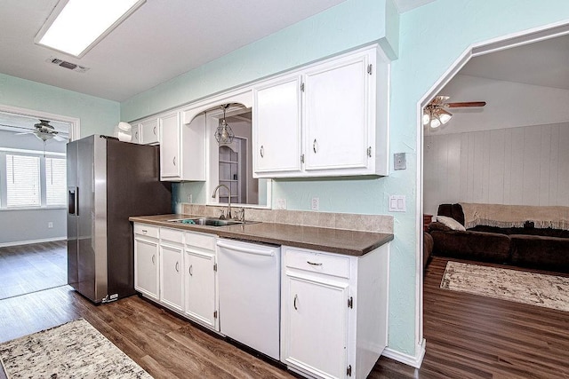 5714 Stage Line Dr, Arlington, TX 76017 - kitchen featuring ceiling fan, dishwasher, stainless steel fridge, dark wood-type flooring, and wooden walls