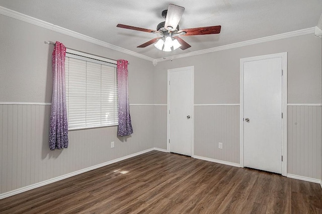 5714 Stage Line Dr, Arlington, TX 76017 - unfurnished bedroom featuring wood finished floors, wainscoting, ornamental molding, and ceiling fan