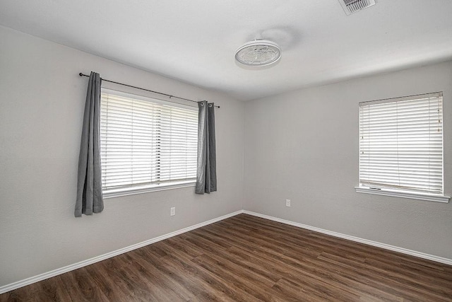 5714 Stage Line Dr, Arlington, TX 76017 - spare room featuring dark wood finished floors and baseboards