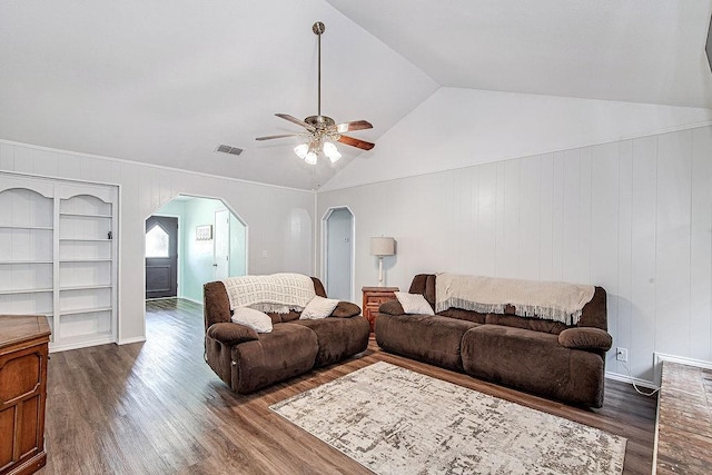 5714 Stage Line Dr, Arlington, TX 76017 - living area featuring arched walkways, wood finished floors, ceiling fan, built in shelves, and lofted ceiling
