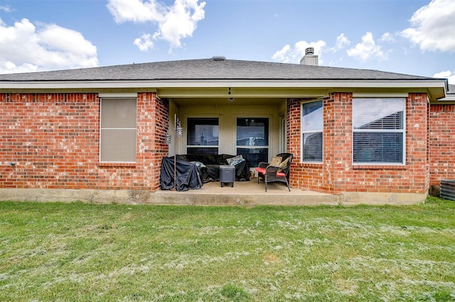 953 Mesa Vista Dr, Crowley, TX 76036 - rear view of house with brick siding, a patio area, a yard, and a chimney