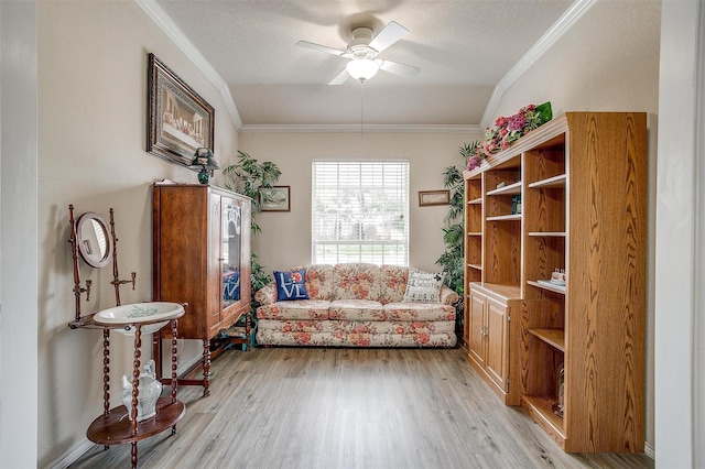 953 Mesa Vista Dr, Crowley, TX 76036 - living area featuring ceiling fan, light wood-type flooring, and ornamental molding