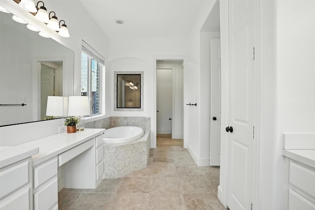 1312 Bluebell Ave, Lantana, TX 76226 - bathroom with vanity and a garden tub