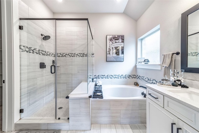 3604 Chapman Cir, Rowlett, TX 75089 - bathroom featuring a bath, a shower stall, double vanity, and lofted ceiling