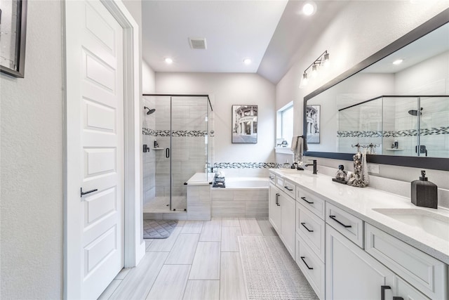3604 Chapman Cir, Rowlett, TX 75089 - full bathroom featuring a stall shower, a garden tub, double vanity, and recessed lighting