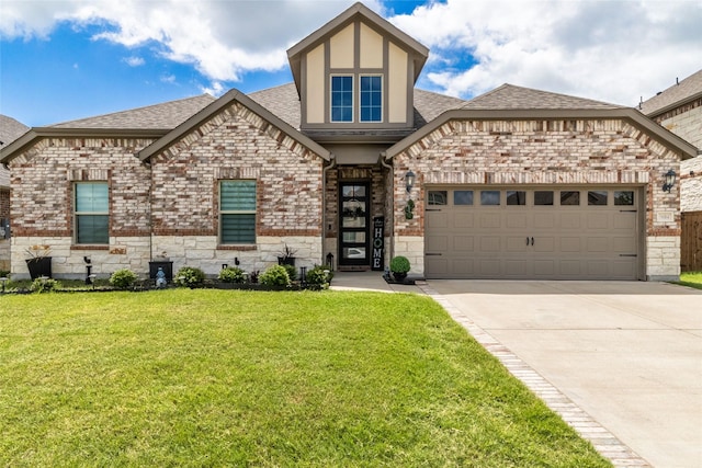 3604 Chapman Cir, Rowlett, TX 75089 - view of front facade featuring concrete driveway, a front lawn, an attached garage, roof with shingles, and brick siding