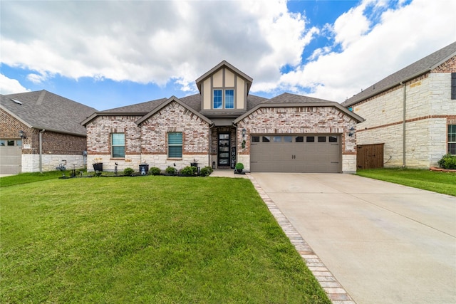 3604 Chapman Cir, Rowlett, TX 75089 - view of front of home featuring an attached garage, brick siding, driveway, and a shingled roof