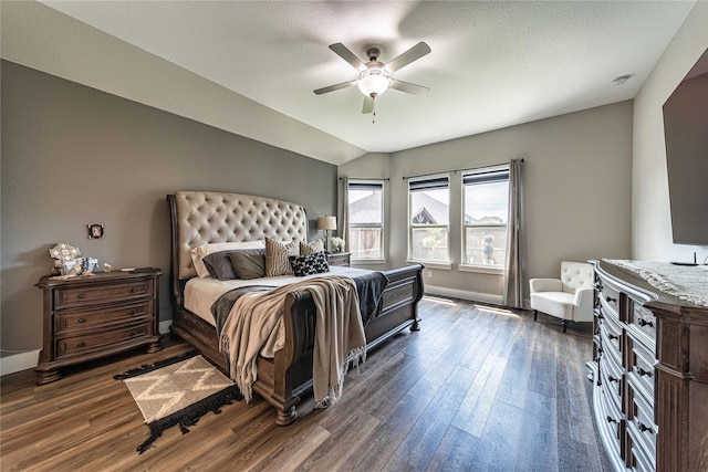 3604 Chapman Cir, Rowlett, TX 75089 - bedroom featuring dark wood-style flooring, a ceiling fan, and vaulted ceiling