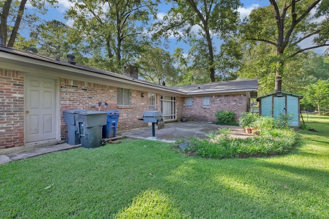 3053 Pines Rd, Shreveport, LA 71119 - back of house featuring a patio area, a storage unit, a lawn, brick siding, and a chimney
