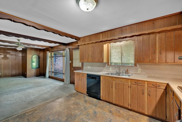 3053 Pines Rd, Shreveport, LA 71119 - kitchen with black dishwasher, wood walls, plenty of natural light, light countertops, and a ceiling fan