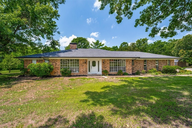 4645 Pecan Place Dr, Mckinney, TX 75071 - ranch-style house with a front lawn, a chimney, and brick siding