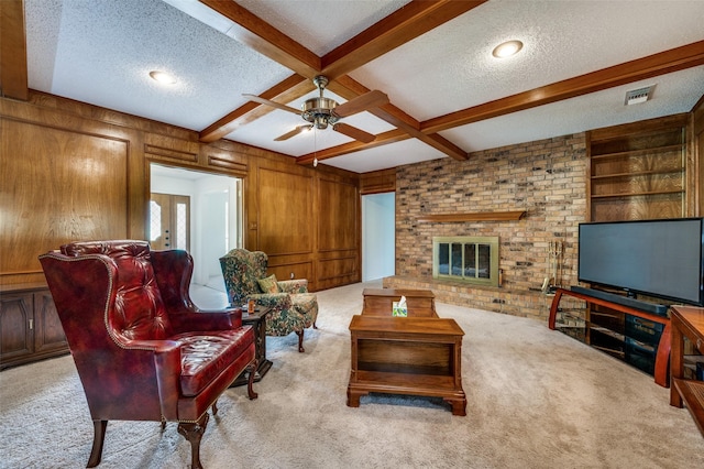 4645 Pecan Place Dr, Mckinney, TX 75071 - living area with a textured ceiling, carpet flooring, beam ceiling, ceiling fan, and wooden walls