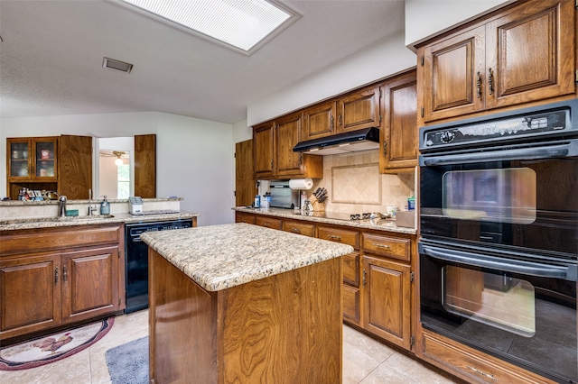 4645 Pecan Place Dr, Mckinney, TX 75071 - kitchen with black appliances, a kitchen island, light tile patterned floors, tasteful backsplash, and lofted ceiling