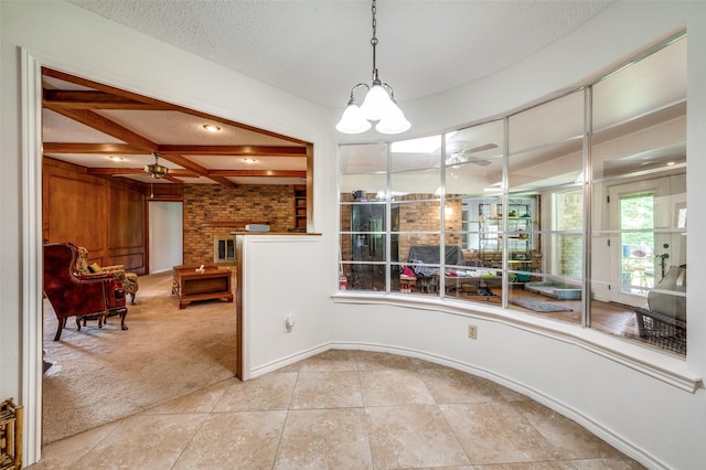 4645 Pecan Place Dr, Mckinney, TX 75071 - dining area with ceiling fan, light carpet, light tile patterned floors, beam ceiling, and a textured ceiling