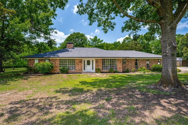 4645 Pecan Place Dr, Mckinney, TX 75071 - single story home featuring a chimney, a front yard, and brick siding