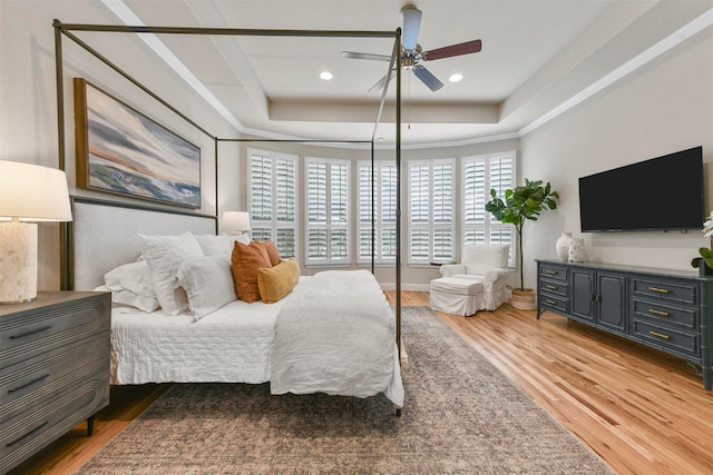 5705 Heron Dr E, Colleyville, TX 76034 - bedroom featuring light wood-type flooring, a tray ceiling, recessed lighting, and ceiling fan