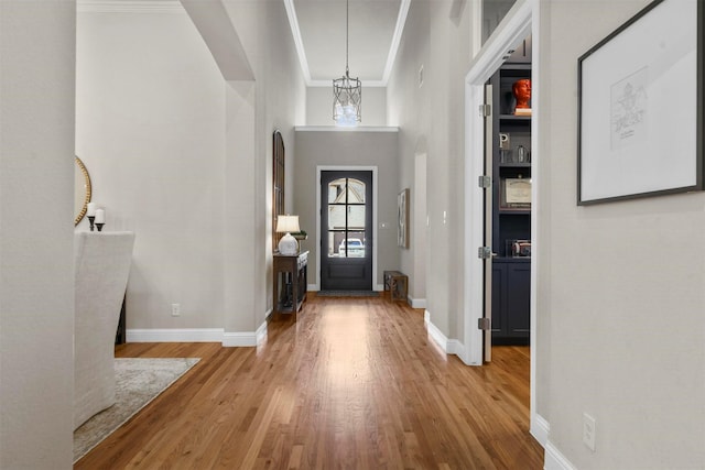 5705 Heron Dr E, Colleyville, TX 76034 - entryway with arched walkways, wood finished floors, and crown molding