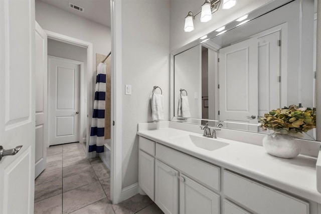 5705 Heron Dr E, Colleyville, TX 76034 - bathroom with vanity, tile patterned floors, and shower / tub combo