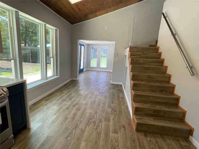 629 Kimbrough St, White Settlement, TX 76108 - staircase featuring wood finished floors, vaulted ceiling, healthy amount of natural light, and wood ceiling